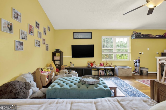 404 Carruth Rd, Winder, GA 30680 - living area featuring wood finished floors, a ceiling fan, and lofted ceiling