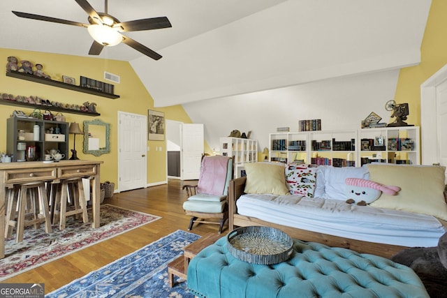 404 Carruth Rd, Winder, GA 30680 - living area featuring a ceiling fan, wood finished floors, vaulted ceiling, and baseboards