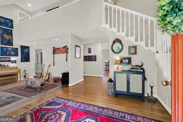 404 Carruth Rd, Winder, GA 30680 - entryway with a towering ceiling, stairs, baseboards, wood finished floors, and recessed lighting