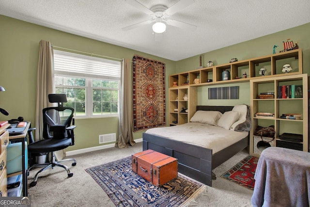 404 Carruth Rd, Winder, GA 30680 - carpeted bedroom featuring a textured ceiling, baseboards, and ceiling fan