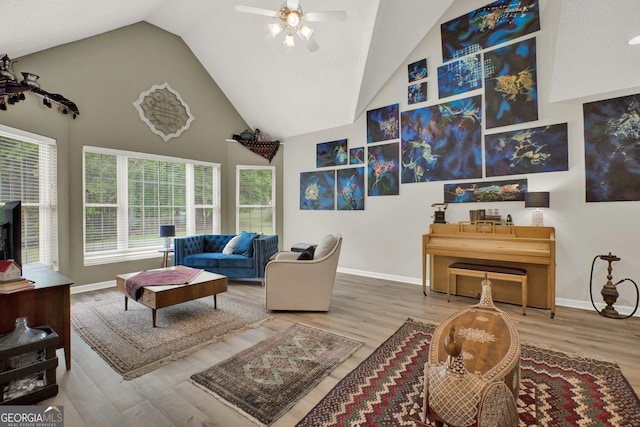 404 Carruth Rd, Winder, GA 30680 - living area featuring a ceiling fan, wood finished floors, baseboards, and high vaulted ceiling