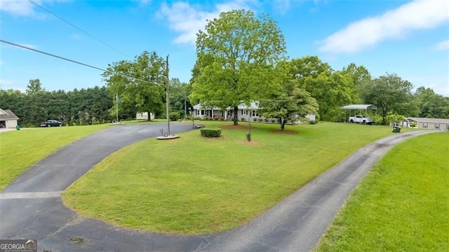 190 Roberts Way, Cornelia, GA 30531 - view of home's community with a lawn, asphalt driveway, and a carport