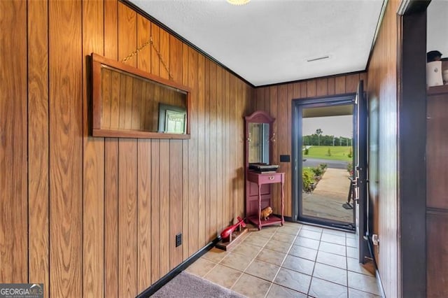 190 Roberts Way, Cornelia, GA 30531 - foyer entrance featuring wood walls, light tile patterned floors, and ornamental molding