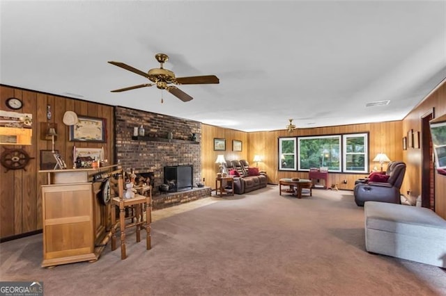 190 Roberts Way, Cornelia, GA 30531 - living area with wood walls, carpet flooring, a ceiling fan, and a brick fireplace