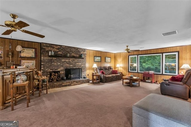 190 Roberts Way, Cornelia, GA 30531 - living room with a ceiling fan, wooden walls, carpet flooring, and a fireplace
