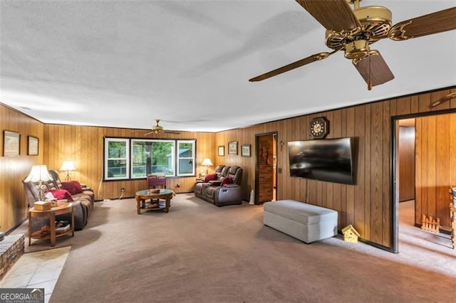 190 Roberts Way, Cornelia, GA 30531 - living room featuring a ceiling fan, light carpet, and wood walls