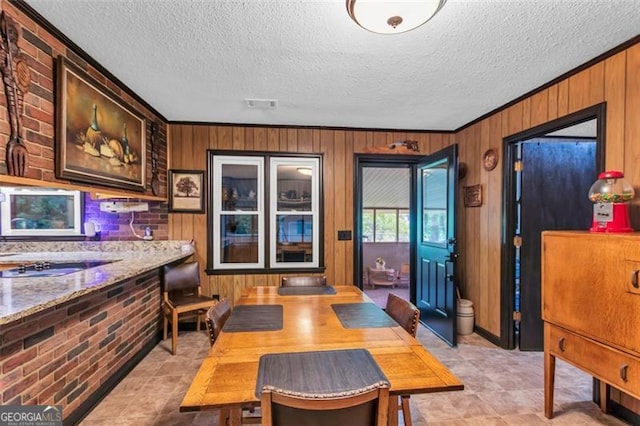 190 Roberts Way, Cornelia, GA 30531 - dining area featuring wooden walls, crown molding, and a textured ceiling