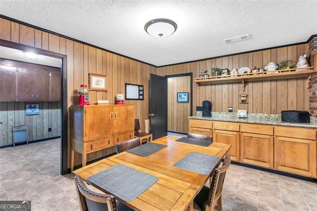 190 Roberts Way, Cornelia, GA 30531 - dining room with a textured ceiling and wooden walls