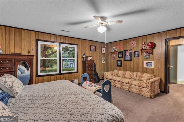 190 Roberts Way, Cornelia, GA 30531 - bedroom featuring carpet floors, wooden walls, a textured ceiling, and ceiling fan