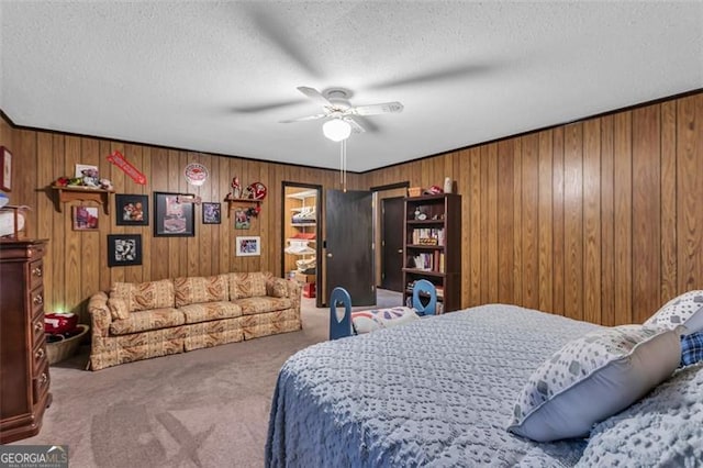 190 Roberts Way, Cornelia, GA 30531 - carpeted bedroom with a textured ceiling, wood walls, and ceiling fan
