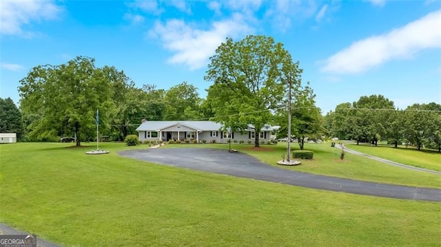 190 Roberts Way, Cornelia, GA 30531 - view of property's community with asphalt driveway, a lawn, and view of wooded area