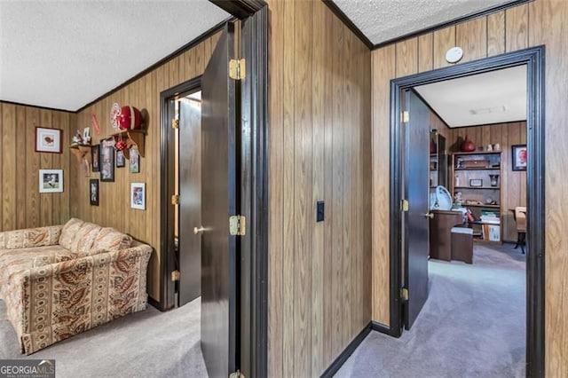 190 Roberts Way, Cornelia, GA 30531 - corridor featuring a textured ceiling, carpet floors, wood walls, and ornamental molding
