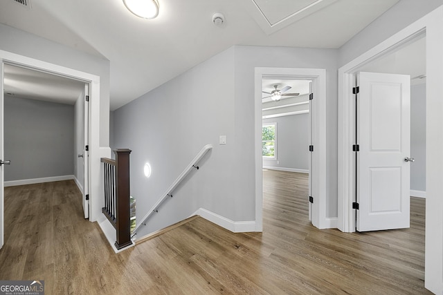 142 Arnco 3rd St, Newnan, GA 30263 - hall with an upstairs landing, wood finished floors, and baseboards
