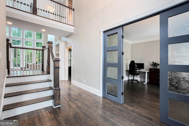 650 Garden Wilde Pl, Roswell, GA 30075 - staircase with baseboards, wood finished floors, and ornamental molding