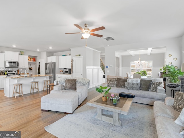 445 Sawmill Trce, Hampton, GA 30228 - living area featuring a chandelier, light wood-type flooring, recessed lighting, ceiling fan, and wainscoting