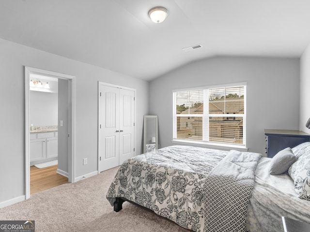 445 Sawmill Trce, Hampton, GA 30228 - bedroom with carpet floors, lofted ceiling, baseboards, a closet, and ensuite bathroom