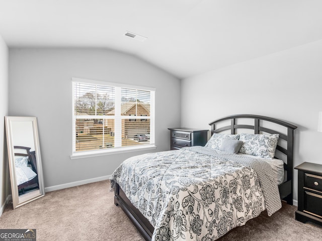445 Sawmill Trce, Hampton, GA 30228 - bedroom with carpet floors, vaulted ceiling, and baseboards