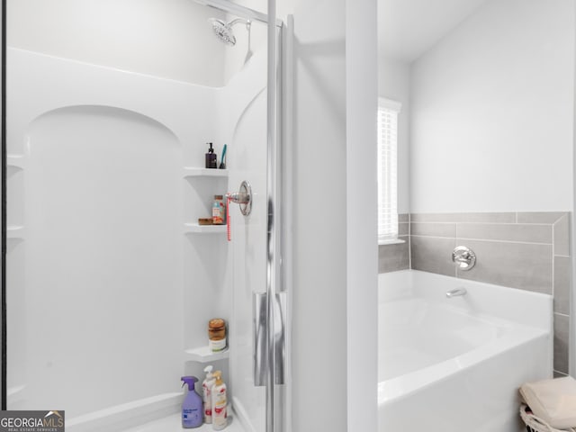 445 Sawmill Trce, Hampton, GA 30228 - bathroom featuring a bath and a shower