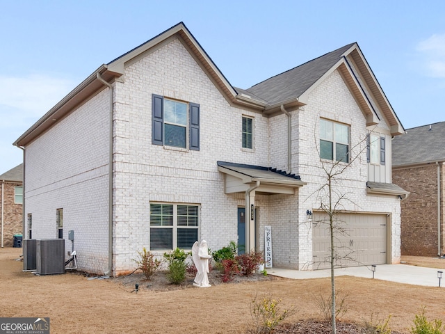 445 Sawmill Trce, Hampton, GA 30228 - view of front facade featuring a garage, concrete driveway, brick siding, and central AC