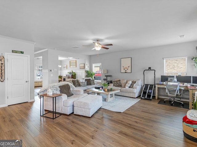 445 Sawmill Trce, Hampton, GA 30228 - living area with a ceiling fan, plenty of natural light, and wood-type flooring