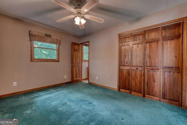 2309 Ridgecrest Cir, Hiawassee, GA 30546 - unfurnished bedroom with carpet, baseboards, a ceiling fan, and a closet