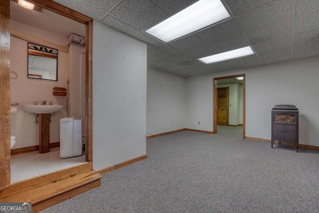 2309 Ridgecrest Cir, Hiawassee, GA 30546 - below grade area featuring a paneled ceiling, baseboards, and carpet floors