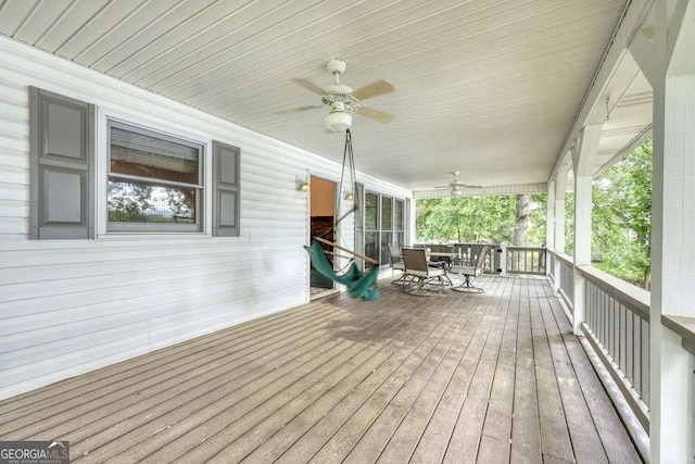 2309 Ridgecrest Cir, Hiawassee, GA 30546 - deck with a ceiling fan and outdoor dining area