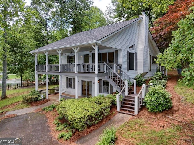 2309 Ridgecrest Cir, Hiawassee, GA 30546 - view of front of house with stairway, a chimney, and roof with shingles