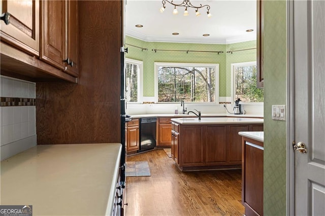 3410 Kates Way, Duluth, GA 30097 - kitchen with dishwasher, wood finished floors, light countertops, a center island, and crown molding