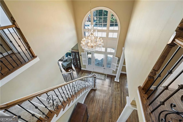3410 Kates Way, Duluth, GA 30097 - entryway featuring a high ceiling, wood finished floors, stairway, a chandelier, and french doors