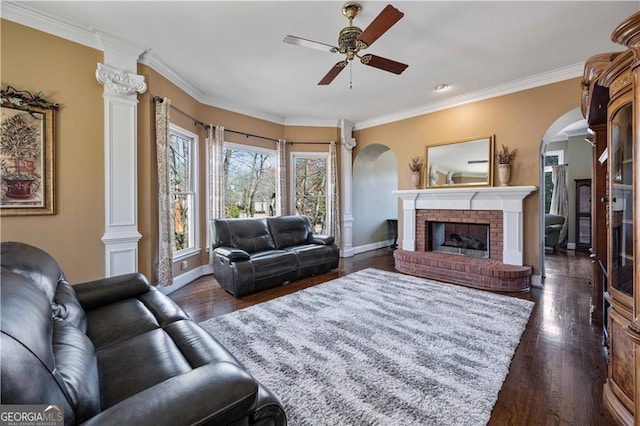 3410 Kates Way, Duluth, GA 30097 - living room featuring arched walkways, a ceiling fan, baseboards, dark wood-style flooring, and crown molding