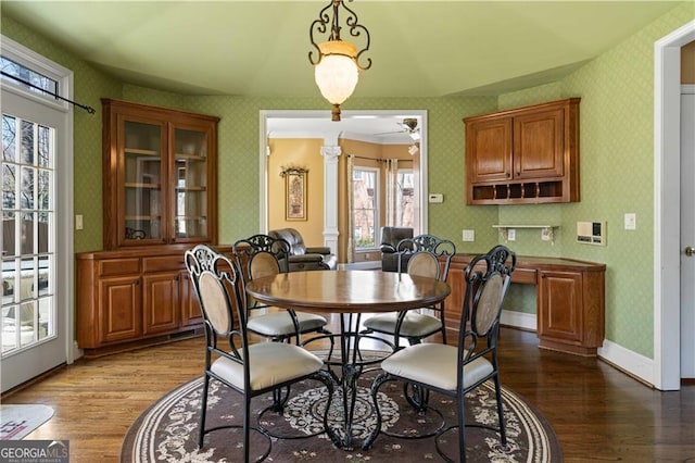 3410 Kates Way, Duluth, GA 30097 - dining area with decorative columns, wood finished floors, wallpapered walls, a ceiling fan, and baseboards