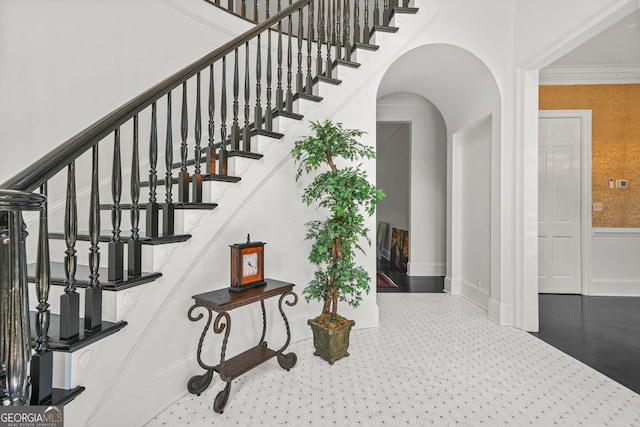 2878 Heather Row Rdg SW, Lilburn, GA 30047 - stairway with arched walkways and baseboards