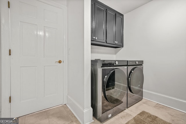 2878 Heather Row Rdg SW, Lilburn, GA 30047 - washroom with washer and dryer, cabinet space, and baseboards