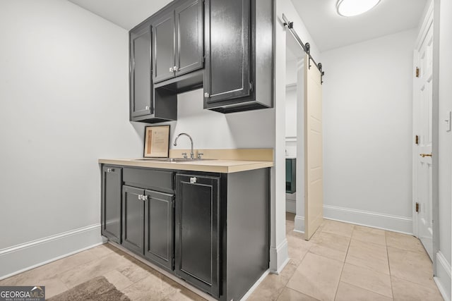 2878 Heather Row Rdg SW, Lilburn, GA 30047 - bar with a sink, baseboards, and a barn door