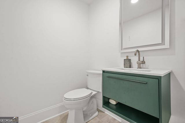 2878 Heather Row Rdg SW, Lilburn, GA 30047 - half bath featuring toilet, vanity, tile patterned floors, and baseboards