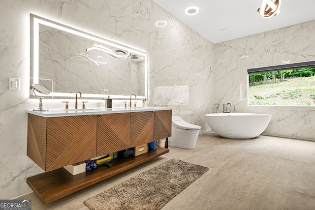 2878 Heather Row Rdg SW, Lilburn, GA 30047 - full bath with stone wall, double vanity, and a freestanding bath