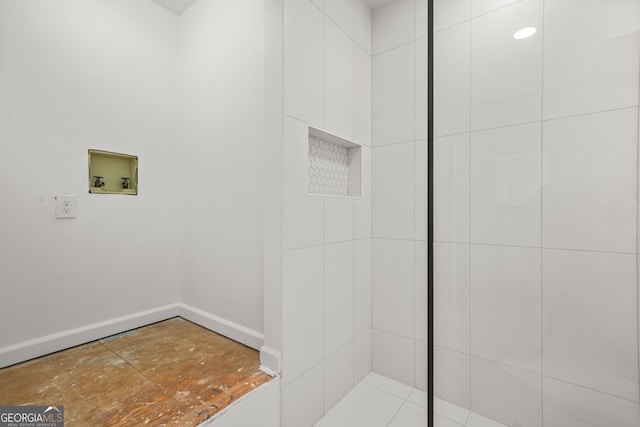 2878 Heather Row Rdg SW, Lilburn, GA 30047 - bathroom featuring baseboards and tiled shower