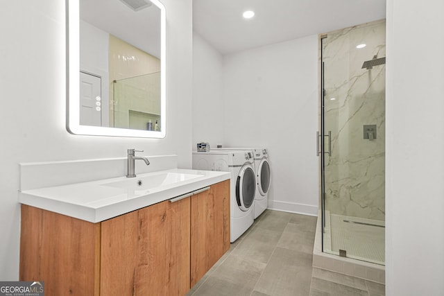 2878 Heather Row Rdg SW, Lilburn, GA 30047 - full bathroom with a marble finish shower, vanity, independent washer and dryer, recessed lighting, and baseboards