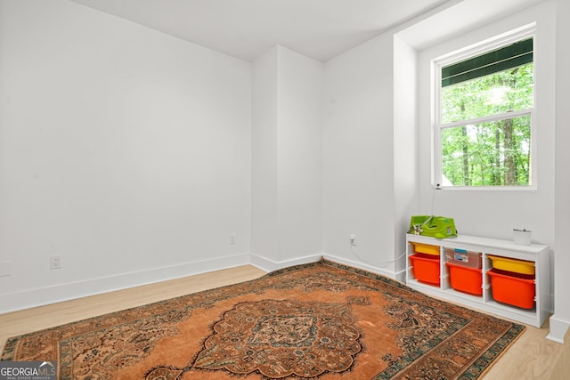 2878 Heather Row Rdg SW, Lilburn, GA 30047 - unfurnished room with wood finished floors and baseboards