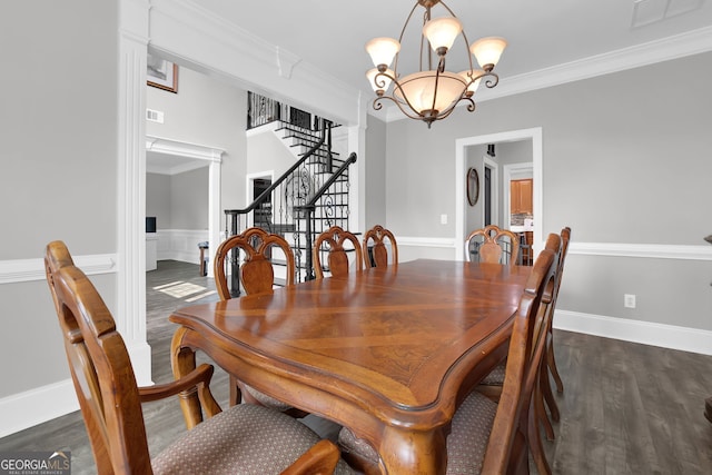 285 Finsbury Park Ct, Suwanee, GA 30024 - dining space featuring a chandelier, dark wood finished floors, stairs, crown molding, and wainscoting