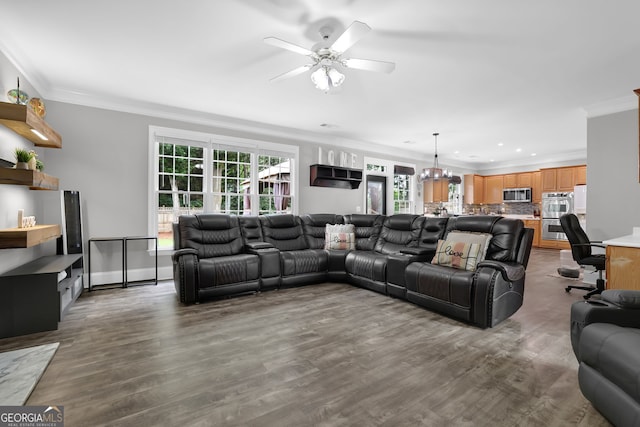 285 Finsbury Park Ct, Suwanee, GA 30024 - living room featuring ornamental molding, a ceiling fan, wood finished floors, a chandelier, and recessed lighting