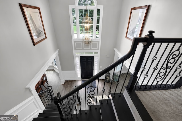 285 Finsbury Park Ct, Suwanee, GA 30024 - stairs with a chandelier and a towering ceiling