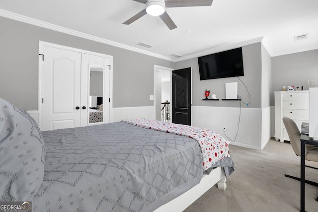 285 Finsbury Park Ct, Suwanee, GA 30024 - bedroom with carpet flooring, ornamental molding, wainscoting, a ceiling fan, and a closet