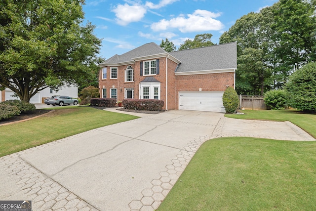285 Finsbury Park Ct, Suwanee, GA 30024 - colonial-style house with driveway, brick siding, roof with shingles, and a garage