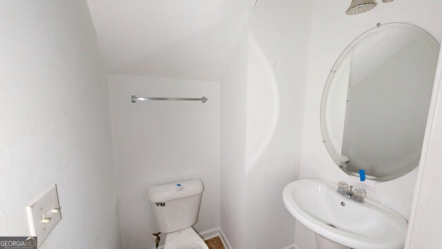 176 Silver Fox Trl, Dallas, GA 30157 - bathroom featuring toilet, a sink, and baseboards