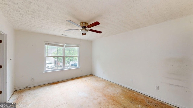 176 Silver Fox Trl, Dallas, GA 30157 - empty room featuring ceiling fan, a textured ceiling, and baseboards