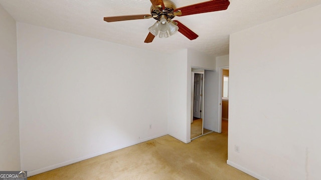 176 Silver Fox Trl, Dallas, GA 30157 - empty room with light carpet, a ceiling fan, and baseboards