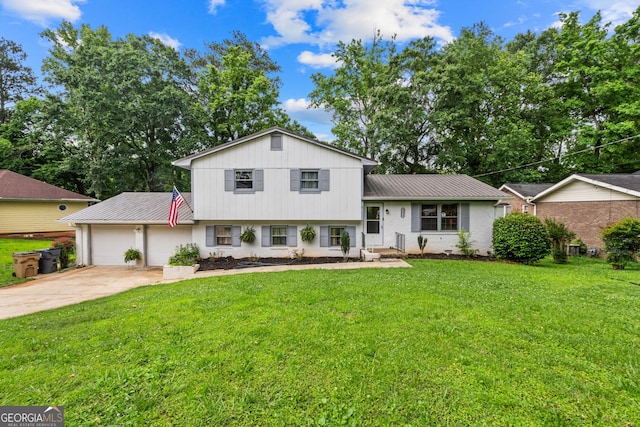 6628 Londonderry Dr, Morrow, GA 30260 - split level home with an attached garage, metal roof, driveway, a front yard, and brick siding