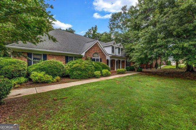 362 Clyde Ct, Mcdonough, GA 30252 - view of front of house featuring a front yard and brick siding